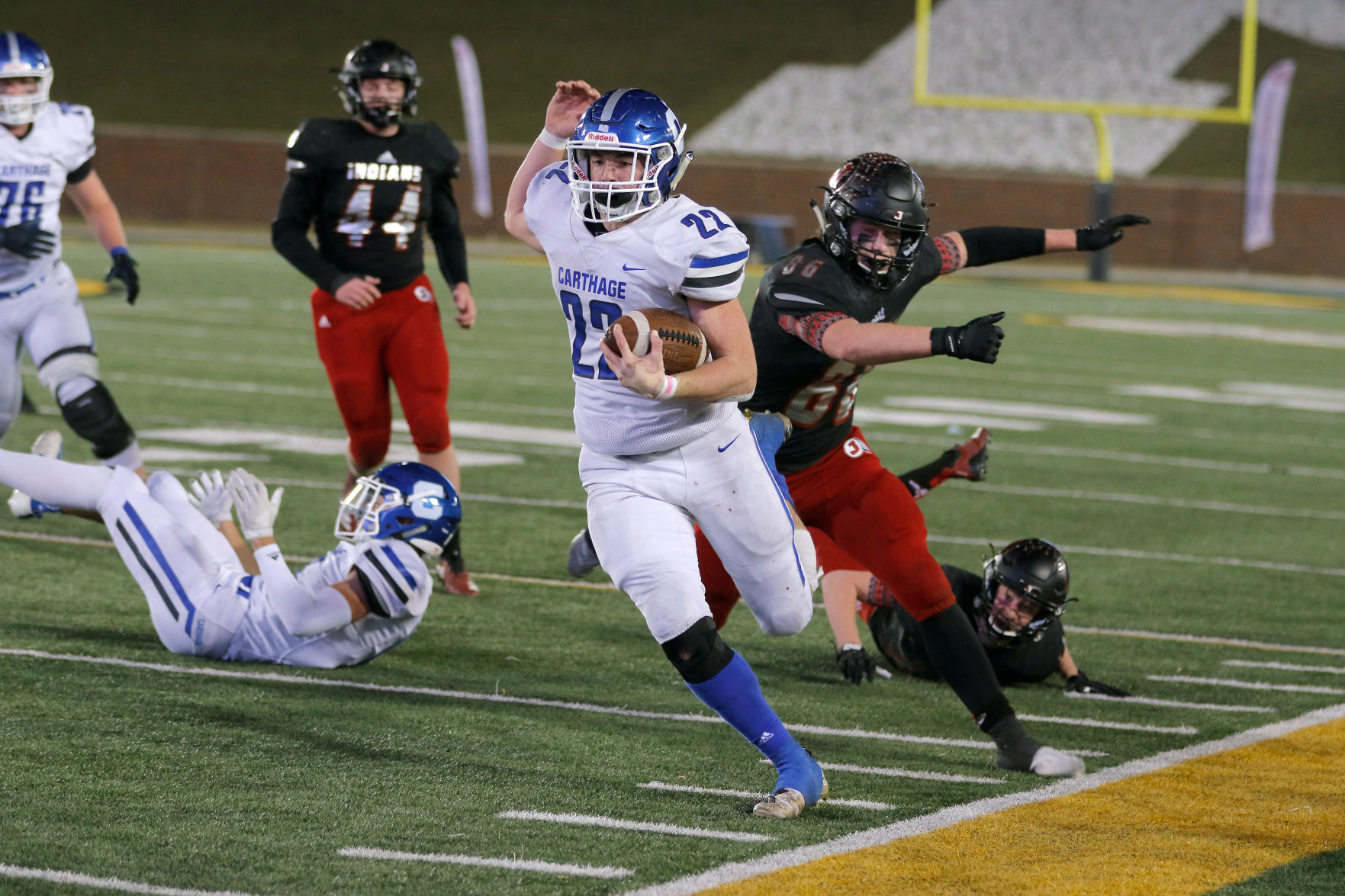 Carthage’s Tyler Mueller tip-toes the sideline attempting to evade Jackson’s Caleb Craft Saturday